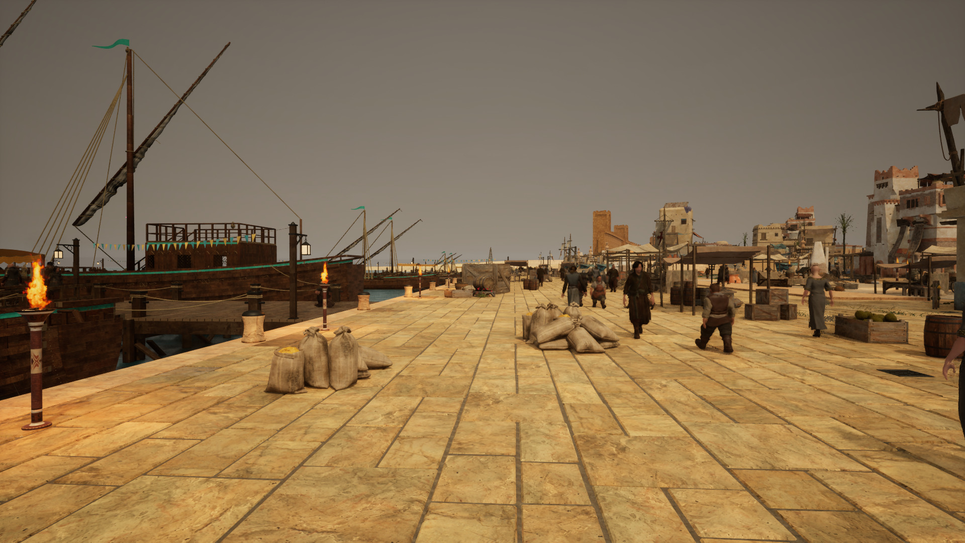 People walk along a stone quay beside sailing ships, stacked cargo, and waterside buildings.